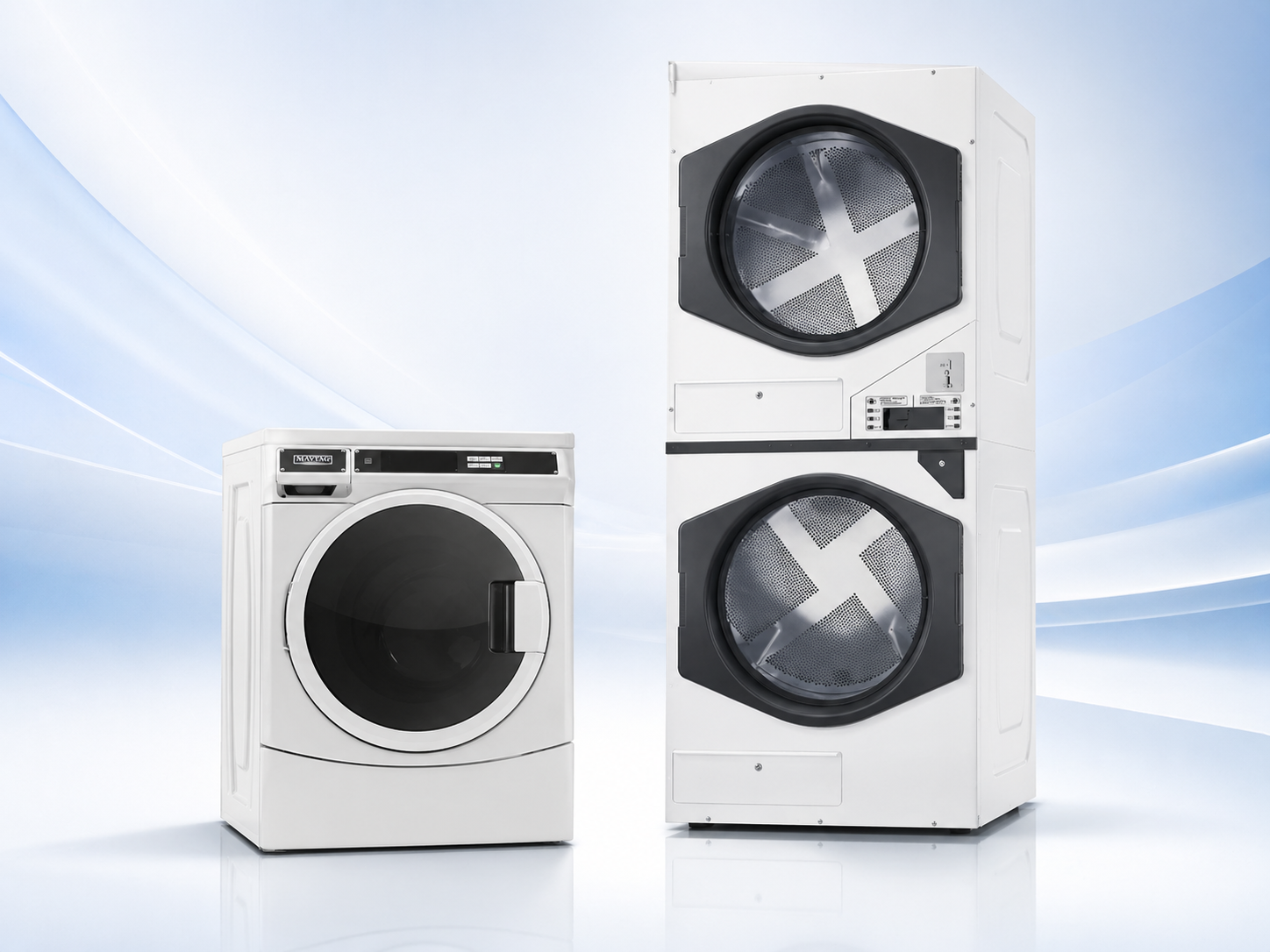 Brand new single load commercial washer beside a double stack dryer